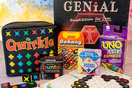 Berlin, Germany - September 10, 2023: Various packs of small games to take away with gaming accessories.のeditorial素材