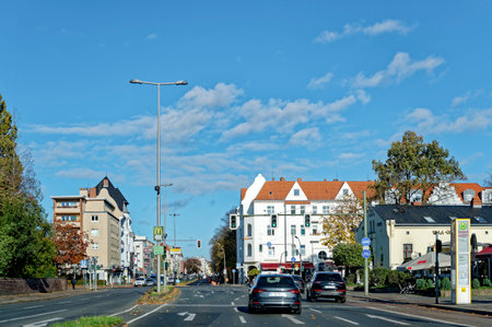 Berlin, Germany - November 04, 2023: Autumnal street scene in Berlin with traffic lights and bus stop.のeditorial素材