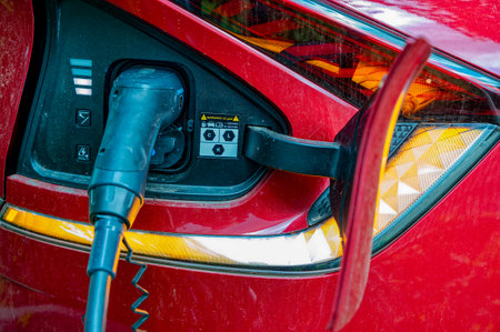 Berlin, Germany - April 23, 2024: View of the charger of an electric car.