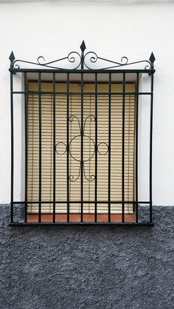 Old window with security bars, steel grillのeditorial素材