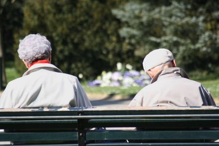 Seniors sitting in a park.の写真素材