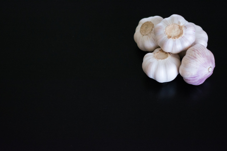 Garlic in dark tableの写真素材