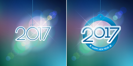 Happy New Year design elements. Merry Christmas decoration and card design. 2017 digits on blue blurred mesh background with defocused light spots. Holiday vector abstract artwork set.のイラスト素材
