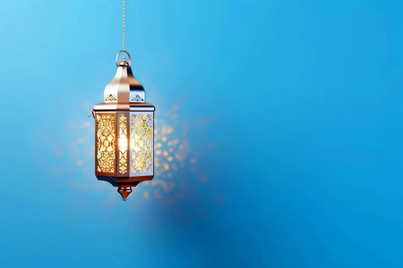 Lantern on blue background. Ramadan Kareem greeting card.の素材