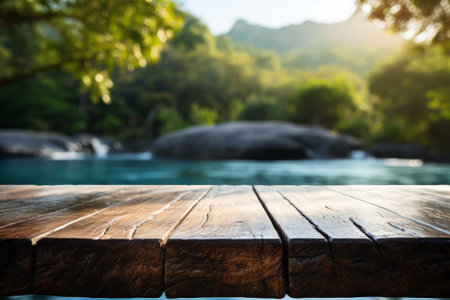 Wooden Table Surface Over Blur of Tranquil Waterfall in Lush Forest. Table surface with waterfall blur in serene forest setting.の素材