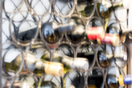Defocus of pub or restuarant wine bottles with bokeh light background, use for montage or product display, business conceptの写真素材