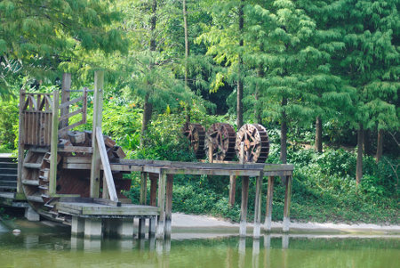 Closeup of waterwheel by the riverの写真素材