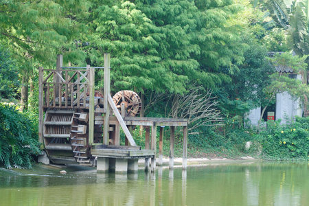 Closeup of waterwheel by the riverの写真素材