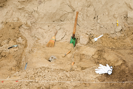 Archaeology tools at excavation site, work in progressの写真素材