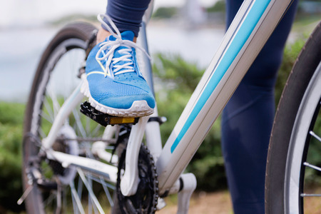 Foot on a bicycle pedalの写真素材