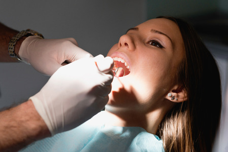 Young woman at dentistの写真素材