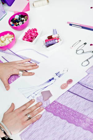 Fashion designer' creating new purple prom dressの写真素材