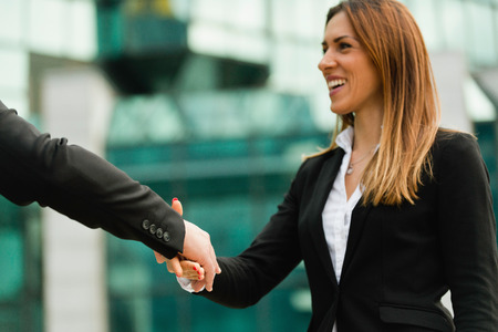 Businesswoman, focus on handshakeの写真素材