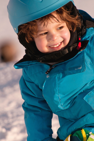 Portrait of little boy in snowの写真素材