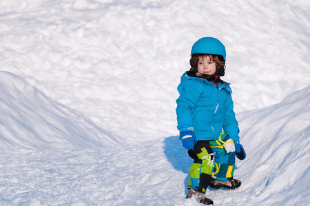 Cute little boy enjoying the snowの写真素材