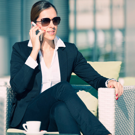 Young business woman on the phoneの写真素材