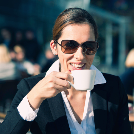 Business woman drinking coffee on breakの写真素材