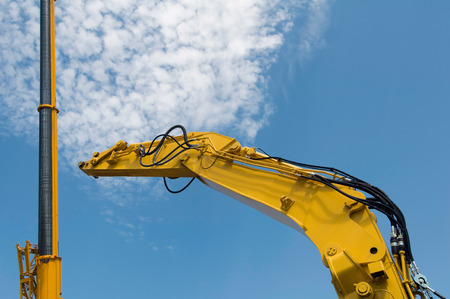 Construction lifters agains the skyの写真素材