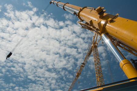 Construction cranes against the sky. Wide angle with convenient copy space