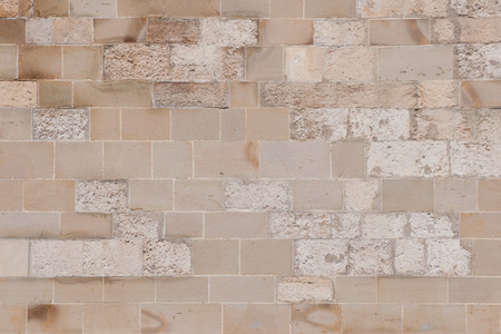 Old stone block wall, convenient as backgroundの写真素材