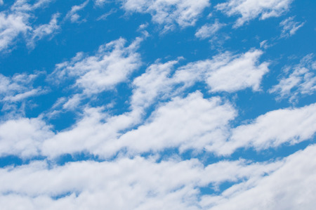 Fluffy clouds on a blue sky. Flat focus, polarizing filter, covenient for backgroundsの写真素材