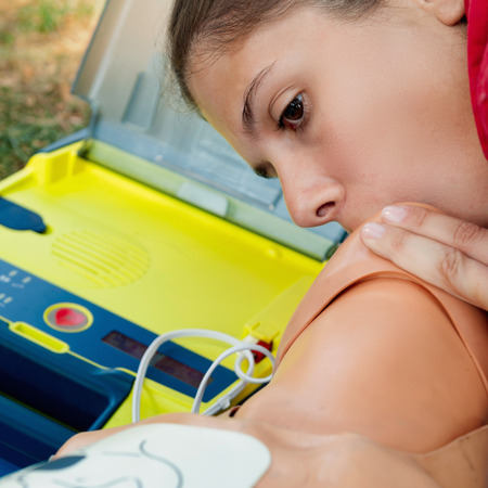 CPR training, mouth to mouth by young femaleの写真素材
