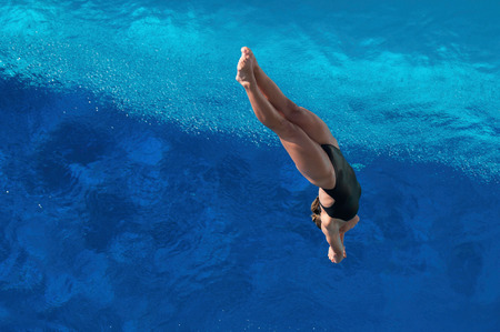 Female diver on the way to the water. Selective focus, convenient copy spaceの写真素材