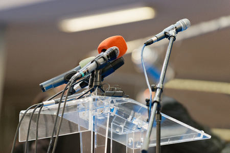 Microphones waiting on a press conference standの写真素材
