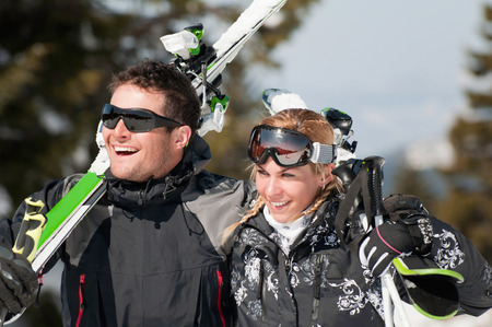 Young smiling couple on a skiing vacationの写真素材