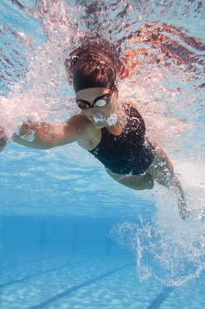 Underwater image of a front crawl swimming motion. High shutter speed used to freeze detailsの写真素材