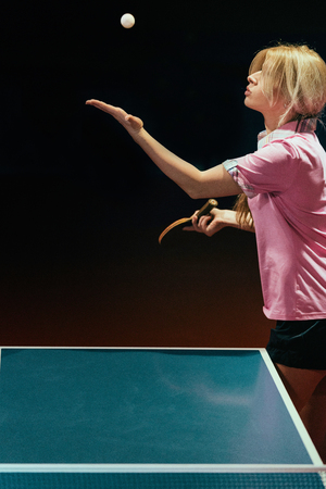 Female table tennis player servingの写真素材