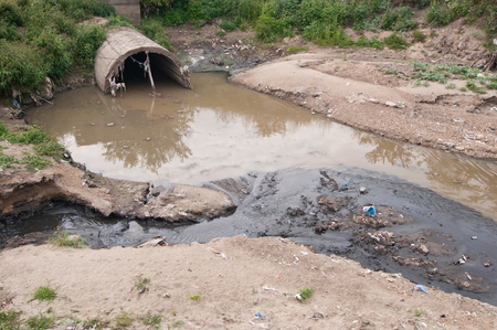 Serious sewage water pollution on the river bankの写真素材