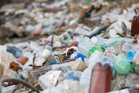 Garbage dump, selective focus set on the plastic bottle in the center, no logosの写真素材