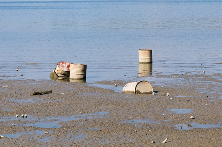 Water pollution: discarded oil drumsの写真素材