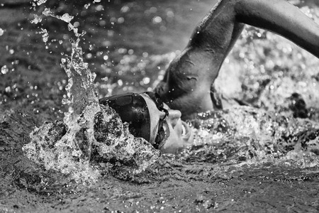 Swimming fast - high speed action shot in black and whiteの写真素材