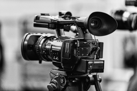 TV camera at the press conference. Black and white