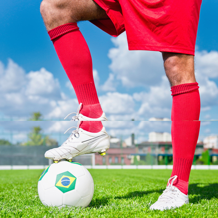 Soccer player with Brazilian ball, about to kick-offの写真素材