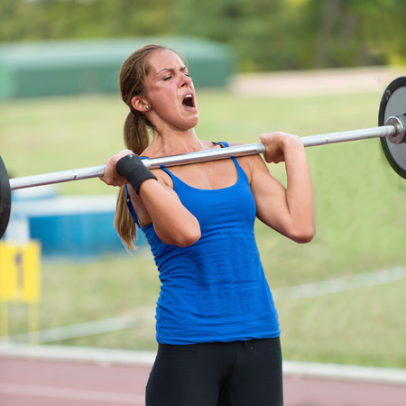 Female crossfit competitor doing deadliftsの写真素材