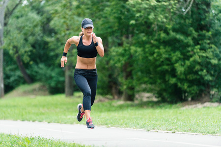 Attractive young woman jogging outdoors