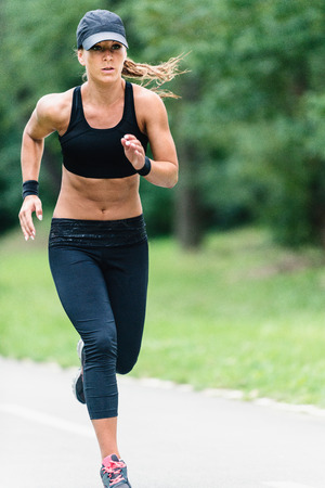 Young woman jogging in parkの写真素材
