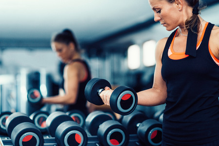 Young attractive woman exercising in the gymの写真素材