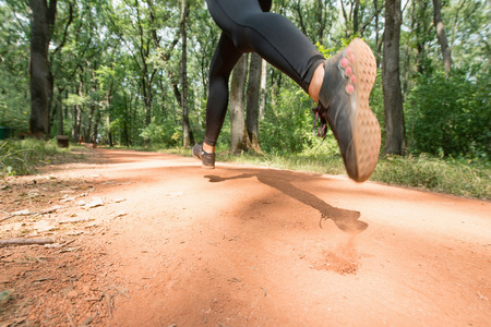 Jogging on the forest trail, motion blurの写真素材