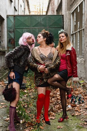 Sex workers - male and female prostitutes posing in back alleyの写真素材