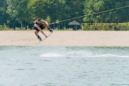 Man jump on wakeboard on jakeの写真素材