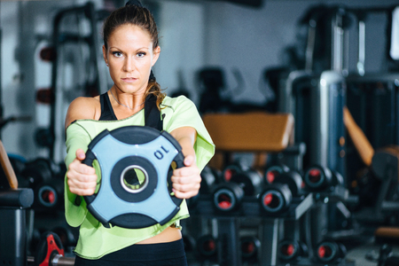 Female athlete training in gymの写真素材