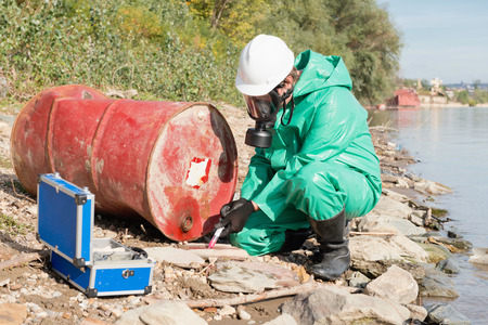 Environmentalist taking sample at pollution siteの写真素材