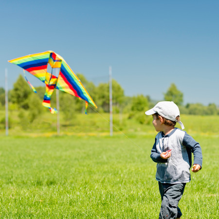 Little boy playing with kiteの写真素材