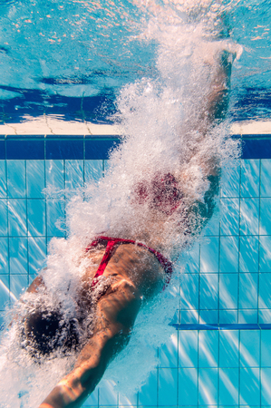 Diving into the swimming poolの写真素材