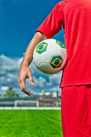 Soccer player holding Brazilian ballの写真素材