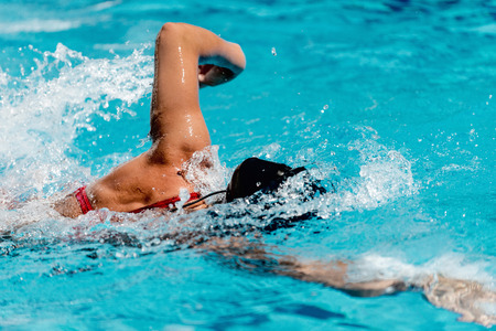 Female athlete swimming front crawlの写真素材